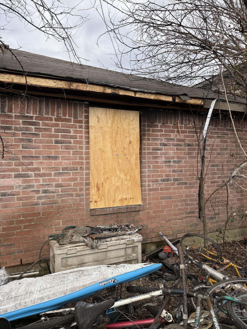 Emergency board-up securing a damaged opening