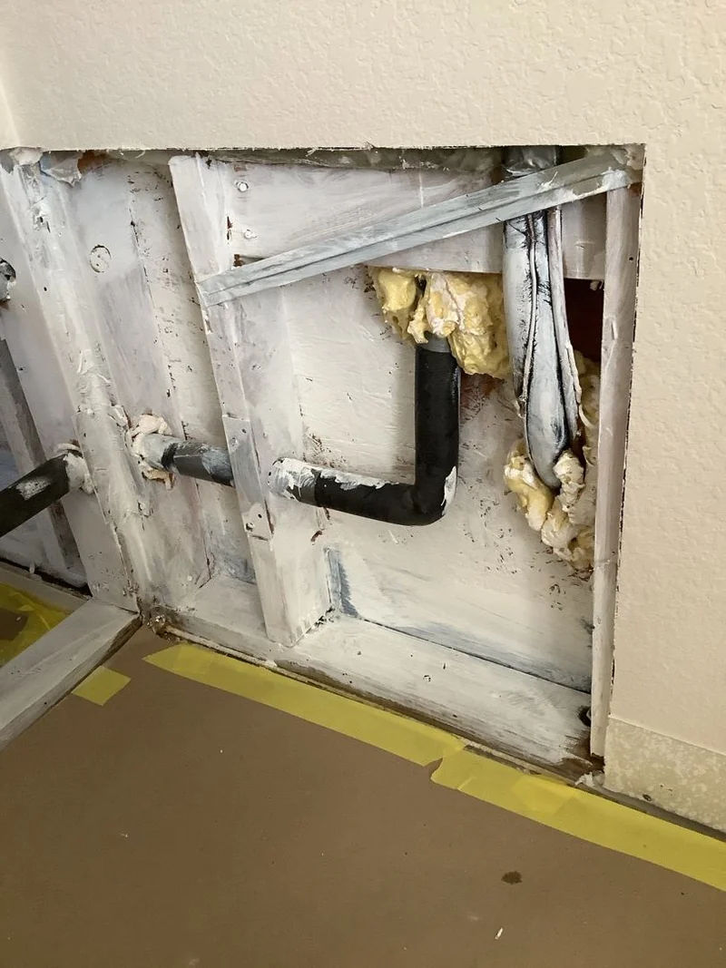 Exposed bathroom wall framing documented during the Southlake remediation